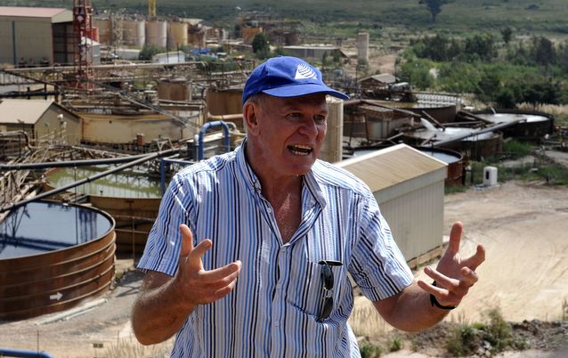 Consultant Prof. Anthony Turton, with the Mintails gold plants and water treatment tanks in the background